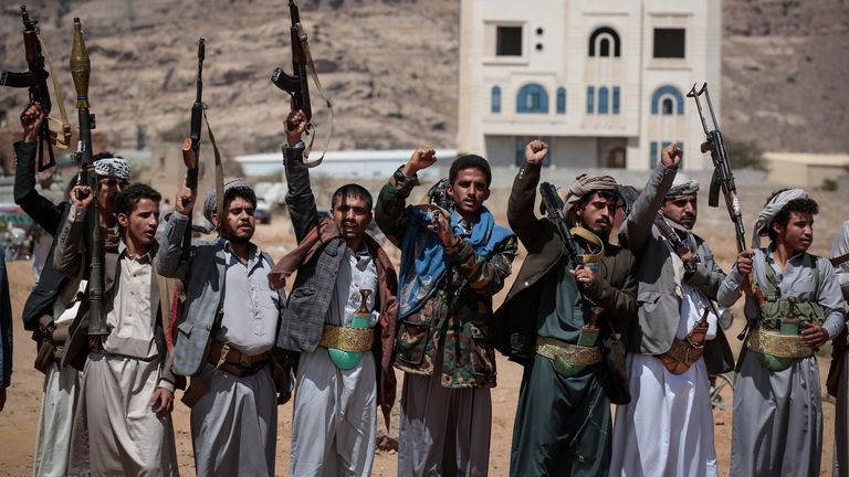 Armed rebels of the Houthi militia attend a funeral procession for victims of a US airstrike in Sanaa. Pic: AP