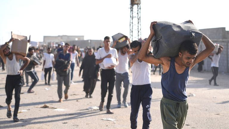 Palestinians carry boxes containing food and humanitarian aid packages delivered by the Gaza Humanitarian Foundation, a U.S.-backed organization approved by Israel, in Rafah.
Pic: AP