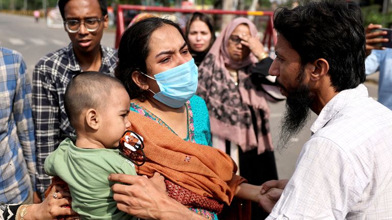 Pakistani citizen Ruwa Talib cries as her Indian husband Mohamad Talib reaches out to take their child, one-year-old Abdan, who is an Indian citizen, before she leaves for Pakistan at the Attari-Wagah border crossing near Amritsar, India.