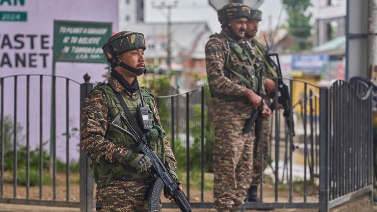 Indian paramilitary soldiers stands guard at a temporary check point on a road leading to the airport after loud explosions were heard in Srinagar, in Indian controlled Kashmir, Saturday, May 10, 2025.(AP Photo/Dar Yasin)