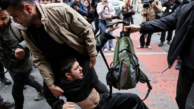 Plain-clothed police officers detain a protester near Taksim Square in Istanbul, Turkey. Pic: Reuters
