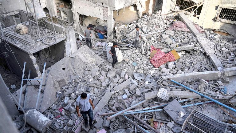 On Wednesday, May 14th, 2025, Palestinians inspect the ruffles destroyed by Israeli air raids in Jabalia, Northern Gaza Strip. According to local hospitals, 48 ​​people were killed in the strikes, including 22 children. (AP Photo/Jehad Alshrafi)