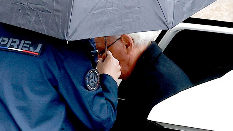 Prison officers escort ex-surgeon Joel Le Scouarnec into court.
File pic: Reuters