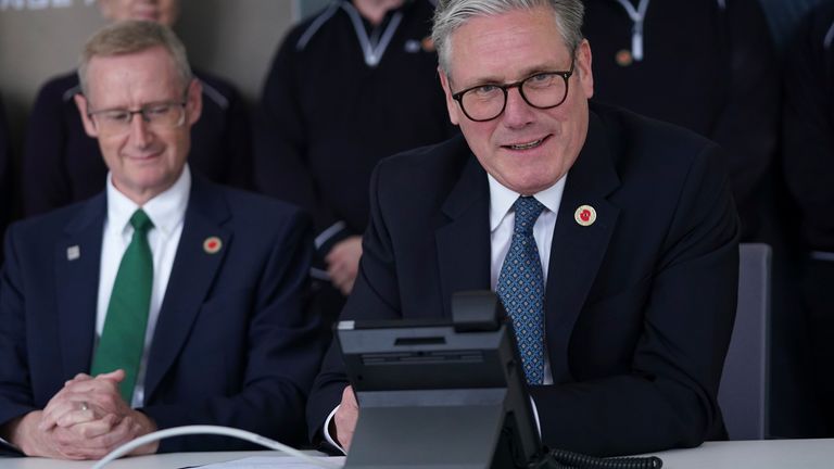 Britain's Prime Minister Keir Starmer speaks on the phone to US President Donald Trump at a car factory in the West Midlands, Thursday, May 8, 2025.(AP Photo/Alberto Pezzali, Pool)