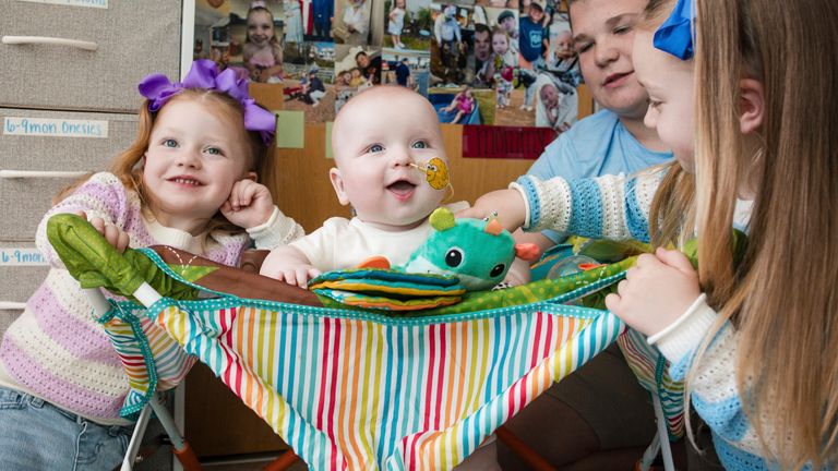 KJ sits with his siblings after a dose of an experimental gene-editing treatment in April 2025. Pic: Chloe Dawson/Children's Hospital of Philadelphia