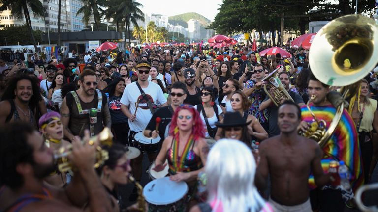 Fans gather on the beach. Pic: Reuters