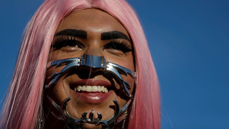 A fan dons an unusual face mask. Pic: AP