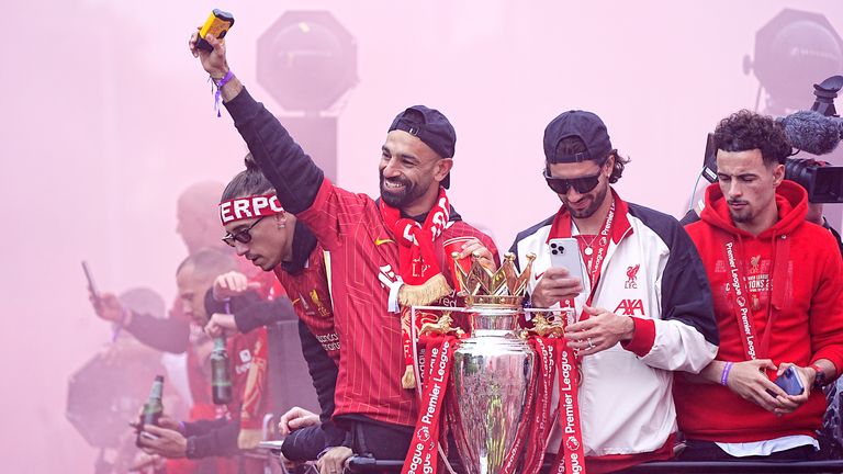 Liverpool&#39;s Mohamed Salah (left) and team-mates on the team bus during the Premier League winners parade in Liverpool.
Pic: PA