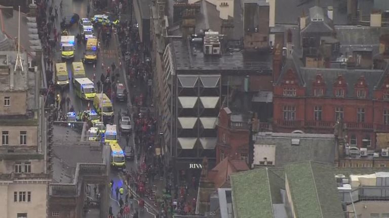Several ambulance and police vehicles at the scene
