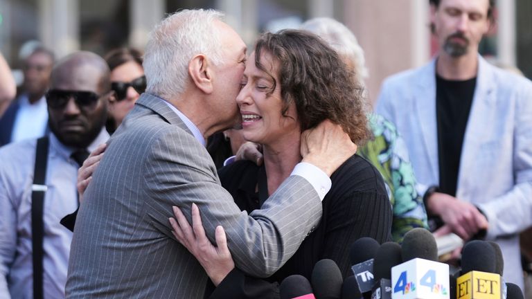 Attorney Mark Geragos hugs Anamaria Baralt, cousin of Erik and Lyle Menendez, after the brothers' resentencing hearing. Pic: AP