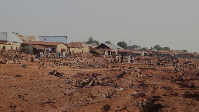 People gathered in a flooded area after heavy rainfall in the market town of Mokwa, north-central Nigeria, Saturday May 31, 2025. Pic: AP