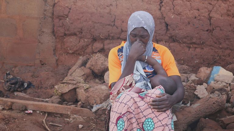 A woman sits in a flooded area after heavy rainfall in the market town of Mokwa, north-central Nigeria, Saturday May 31, 2025. Pic: AP