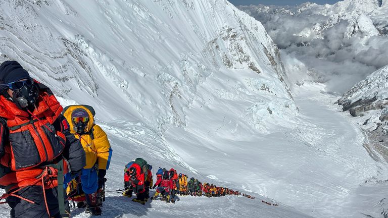 Mountaineers queue up below Camp 4 on the way to the summit of Mount Everest in Nepal, May 17, 2025. (AP Photo/Jenjen Lama)
