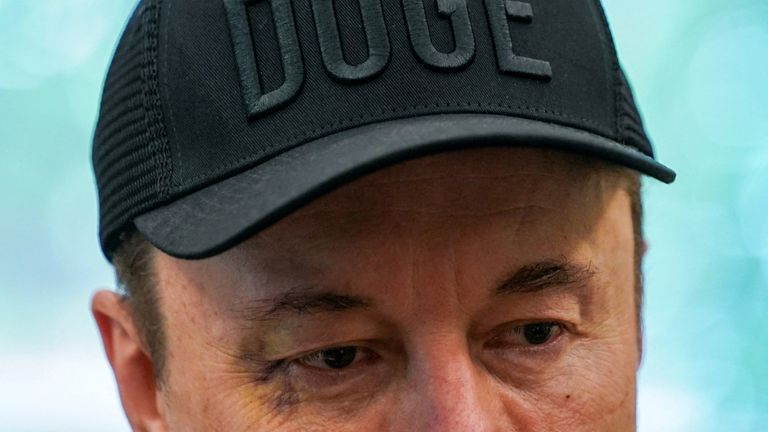 Mr Musk wore a DOGE-branded baseball cap. Pic: Reuters