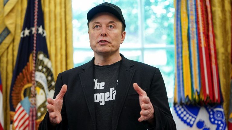 Mr Musk wore a T-shirt with "The Dogefather" written on it. Pic: Reuters