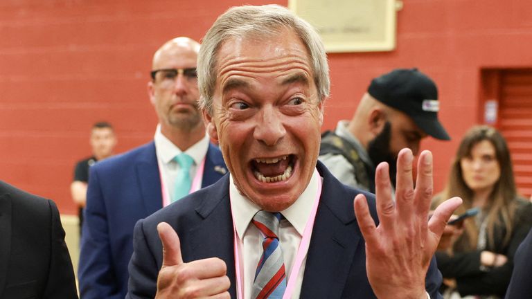 Nigel Farage holds up six fingers to indicate the six votes his party's candidate won by in the Runcorn and Helsby by-election.
Pic: Reuters