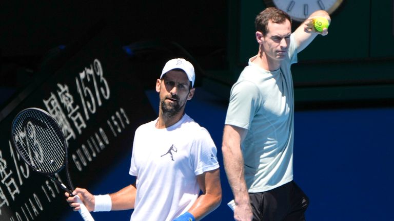 Serbia's Novak Djokovic, left, with his coach Andy Murray during a practice session ahead of the Australian Open tennis championship in Melbourne, Australia, Saturday, Jan. 11, 2025. (AP Photo/Ng Han Guan)