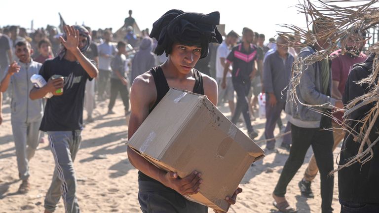 Palestinians carry boxes containing food and humanitarian aid packages delivered by the Gaza Humanitarian Foundation, a U.S.-backed organization approved by Israel, in Rafah.
Pic: AP