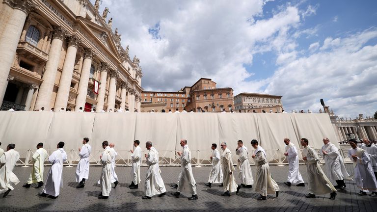 The clergy walk through St Peter's Square. Pic: Reuters