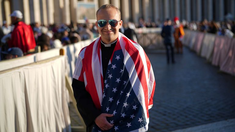 Ethan Menning, 21, from Nebraska, draped in the US flag ahead of the inauguration. Pic: AP