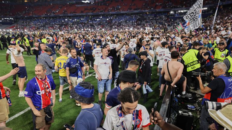 PSG fans rush the field at Allianz Arena in Munich after the team win the Champions League. Pic: AP