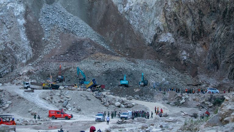 Rescuers search for victims after a natural stone quarry collapsed in Indonesia. Pic: AP