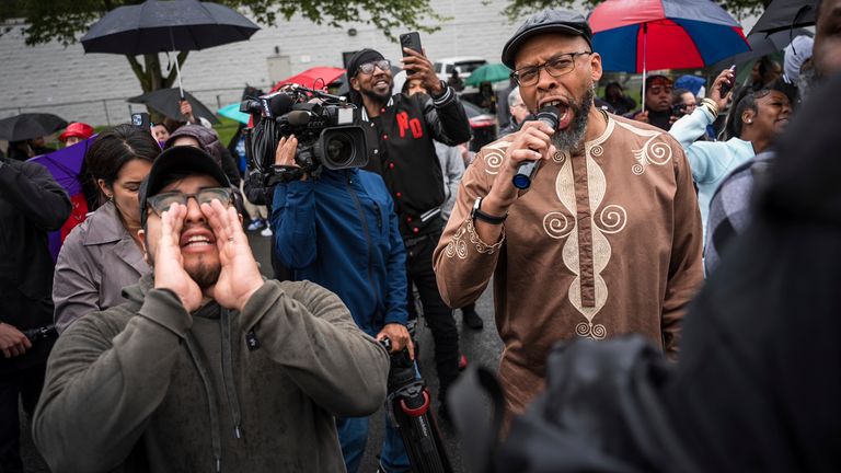 Protesters shout 'let him out' after mayor's arrest. Pic: AP