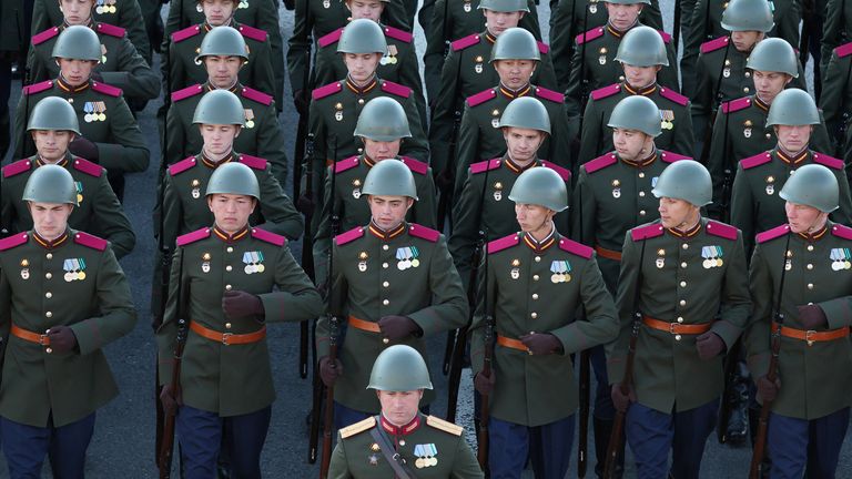 Russian service members wearing a historical uniform march in columns before a military parade on Victory Day. Pic: Reuters