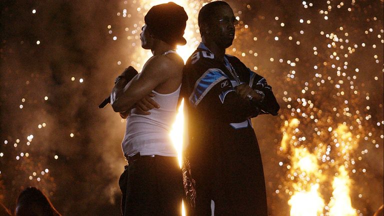 Nelly, left, and P Diddy, right, perform during the Super Bowl halftime show in 2004. Pic: AP/Amy Sancetta
    