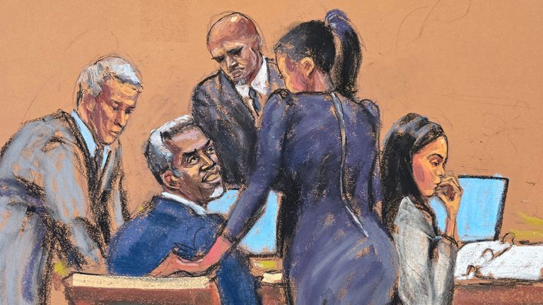 Sean "Diddy" Combs speaks with his legal team before court begins for the day at Combs' sex trafficking trial in New York City, New York, U.S., May 27, 2025 in this courtroom sketch. REUTERS/Jane Rosenberg
