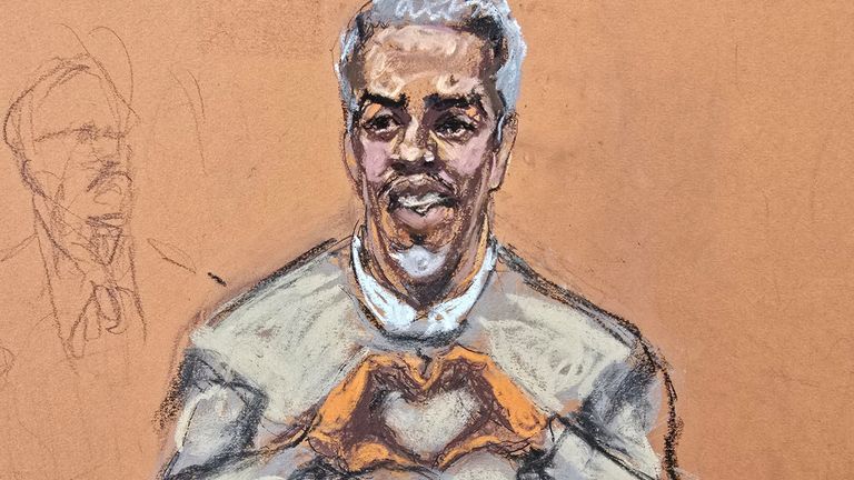 Sean 'Diddy' Combs makes a hand gesture to family members at his New York trial. Pic: Reuters