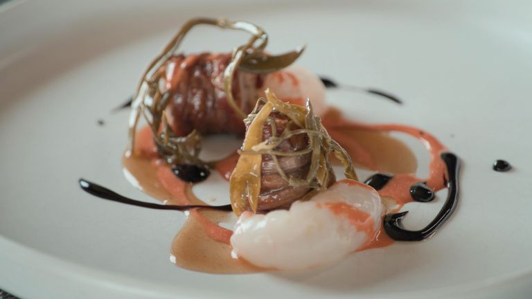 Torcinello, a traditional sausage, served with scampi, sea asparagus, and sweet pepper sauce. Pic: National Geographic