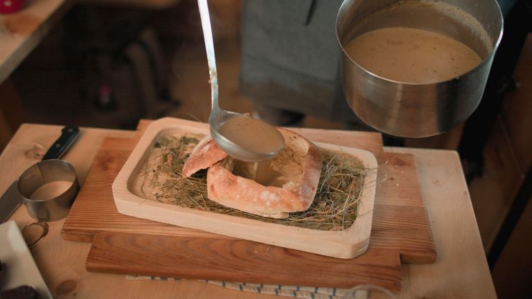 Hay soup in a loaf of homemade bread, served in the restaurant Gostner Schwaige. Pic: National Geographic