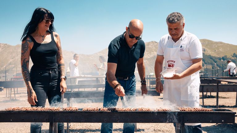 Mr Tucci cooks at BBQ joint Ristoro Mucciante in Abruzzo with one of the owners, Rodolfo Mucciante, right.  Pic: National Geographic/Matt Holyoak