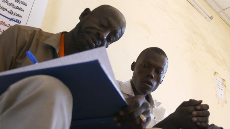 Mohamed (L) used social media to locate Munzir's family
