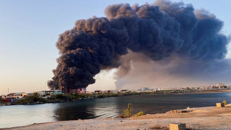A view shows a large plume of smoke and fire rising from fuel depot in Port Sudan.
Pic: Reuters