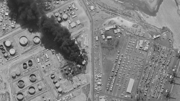 A satellite image shows smoke rising from burning oil tanks in Port Sudan
Pic:Maxar Technologies/Reuters