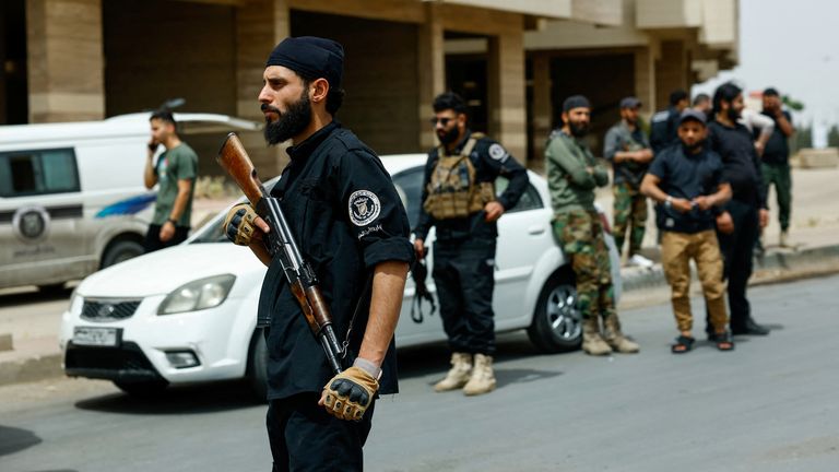 Syrian security forces in the Druze town of Sahnaya on Thursday. Pic: Reuters