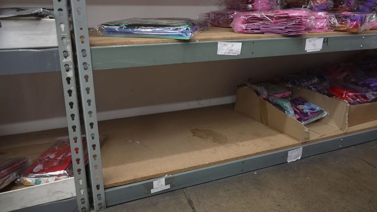 Empty shelves in a party shop
