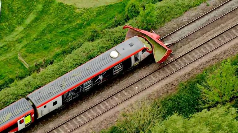 Train hits tractor trailer at level crossing in Herefordshire as arrest made