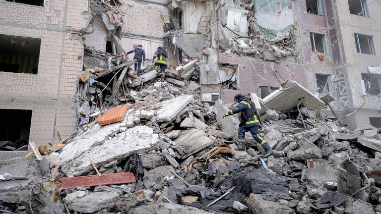 Rescuers work at the site of an apartment building  damaged by a Russian air strike in the frontline town of Kostiantynivka. 
Pic: Ukrainian Armed Forces/Reuters