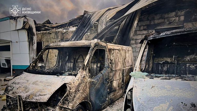 Burnt out cars and buildings in the Kyiv region on Sunday. Pic: AP