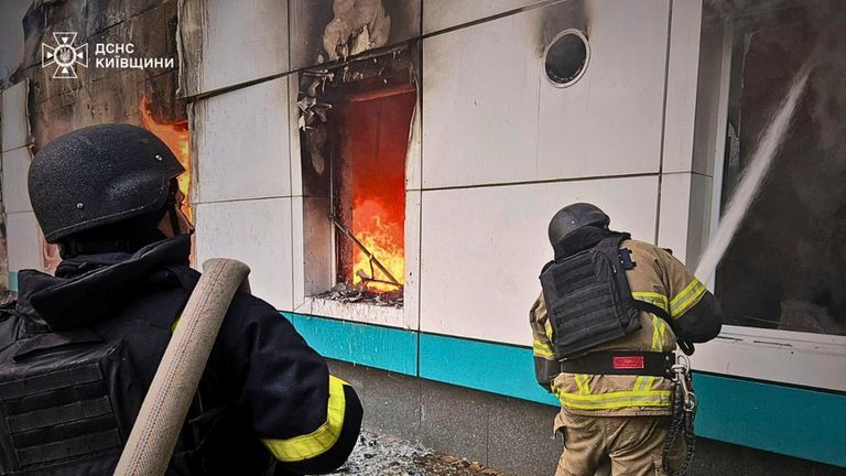 Firefighters at work in the Kyiv region on Sunday. Pic: AP