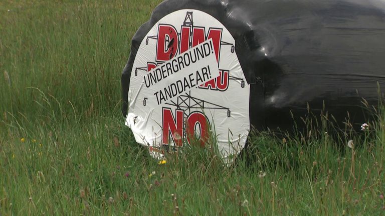 A sign opposing overhead pylons amid local opposition in parts of Wales