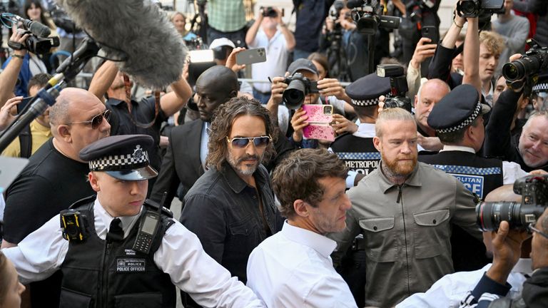 Russell Brand arrives at Westminster Magistrates' Court.
Pic: Reuters