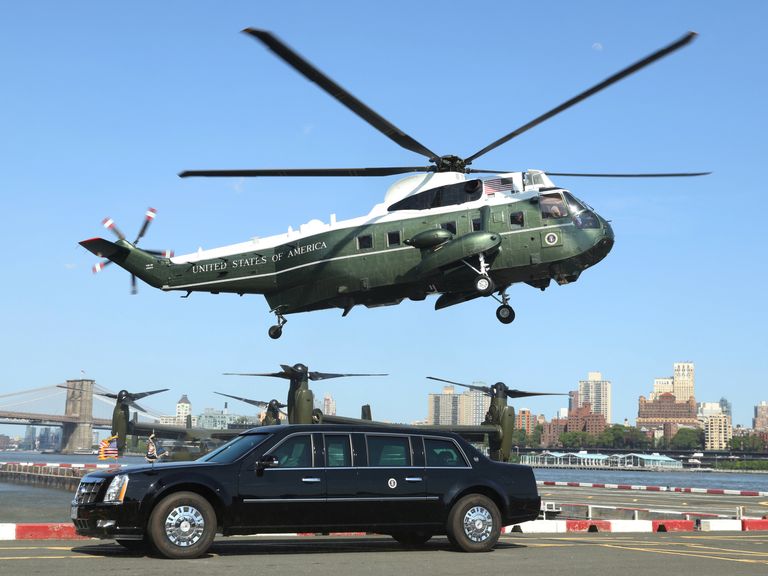Marine One lands behind the Presidential limo as U.S. President Donald Trump arrives at the Downtown Manhattan Heliport in New York, U.S. May 23, 2018. REUTERS/Kevin Lamarque
