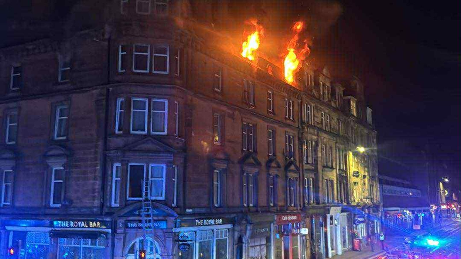 Man dies and girl, 8, in hospital after fire at four-storey building in Scotland