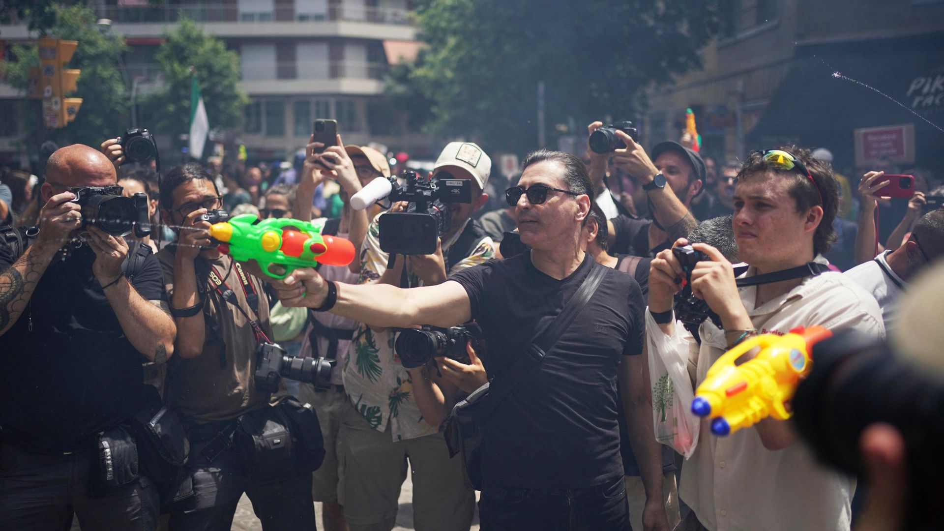 Anti-tourism protesters - some armed with water pistols - call for change in European hotspots