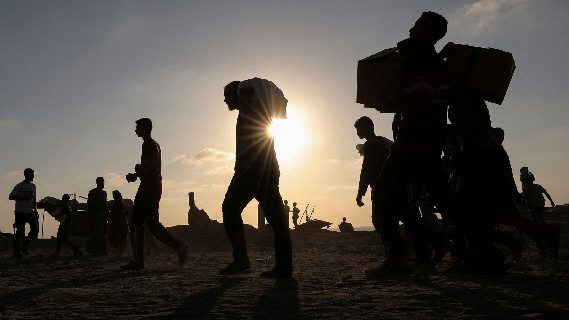 At least 25 people killed after Israeli forces open fire near aid trucks in Gaza, witnesses say