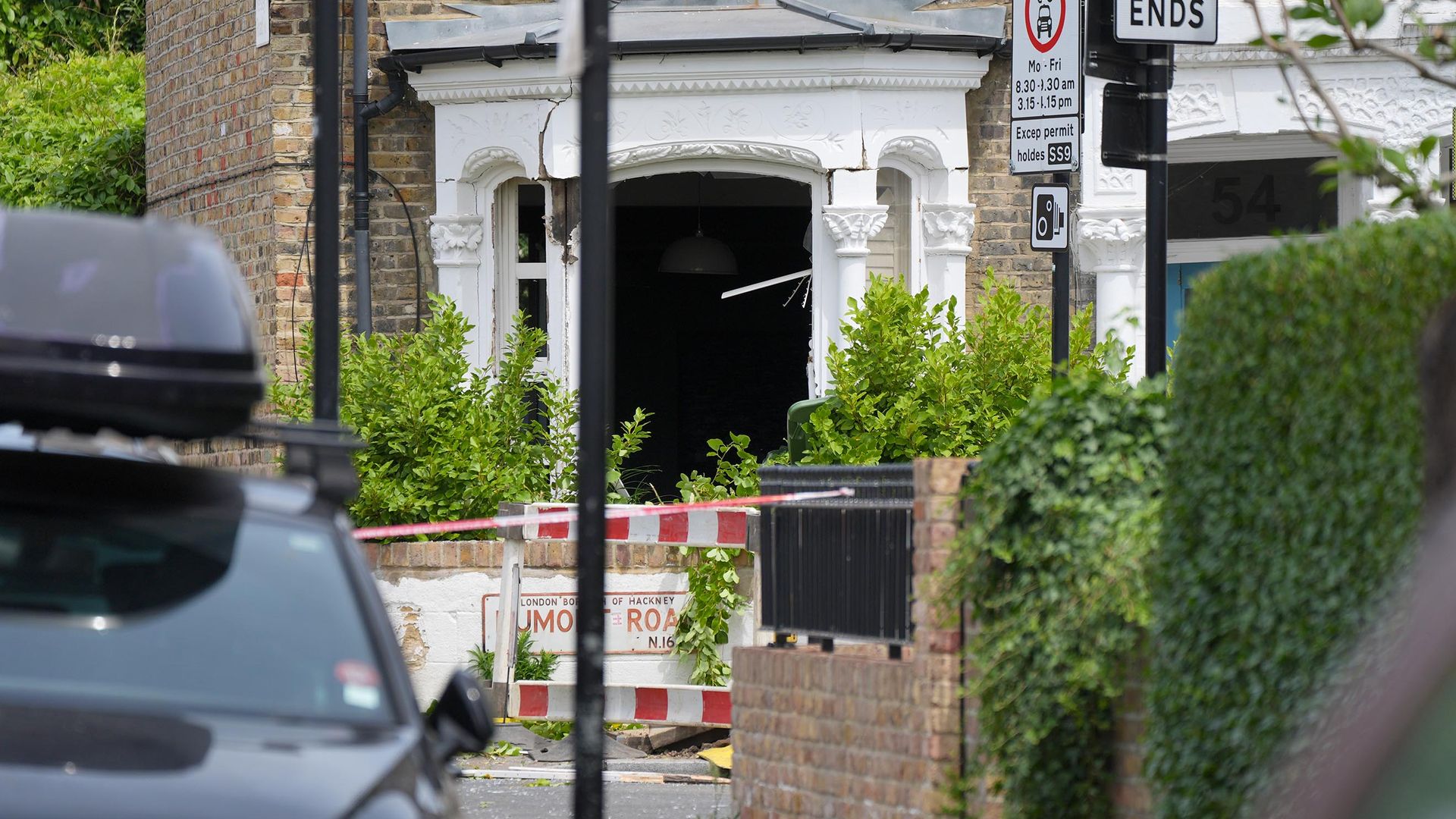 Murder arrest as charity worker found stabbed to death in house after gas explosion